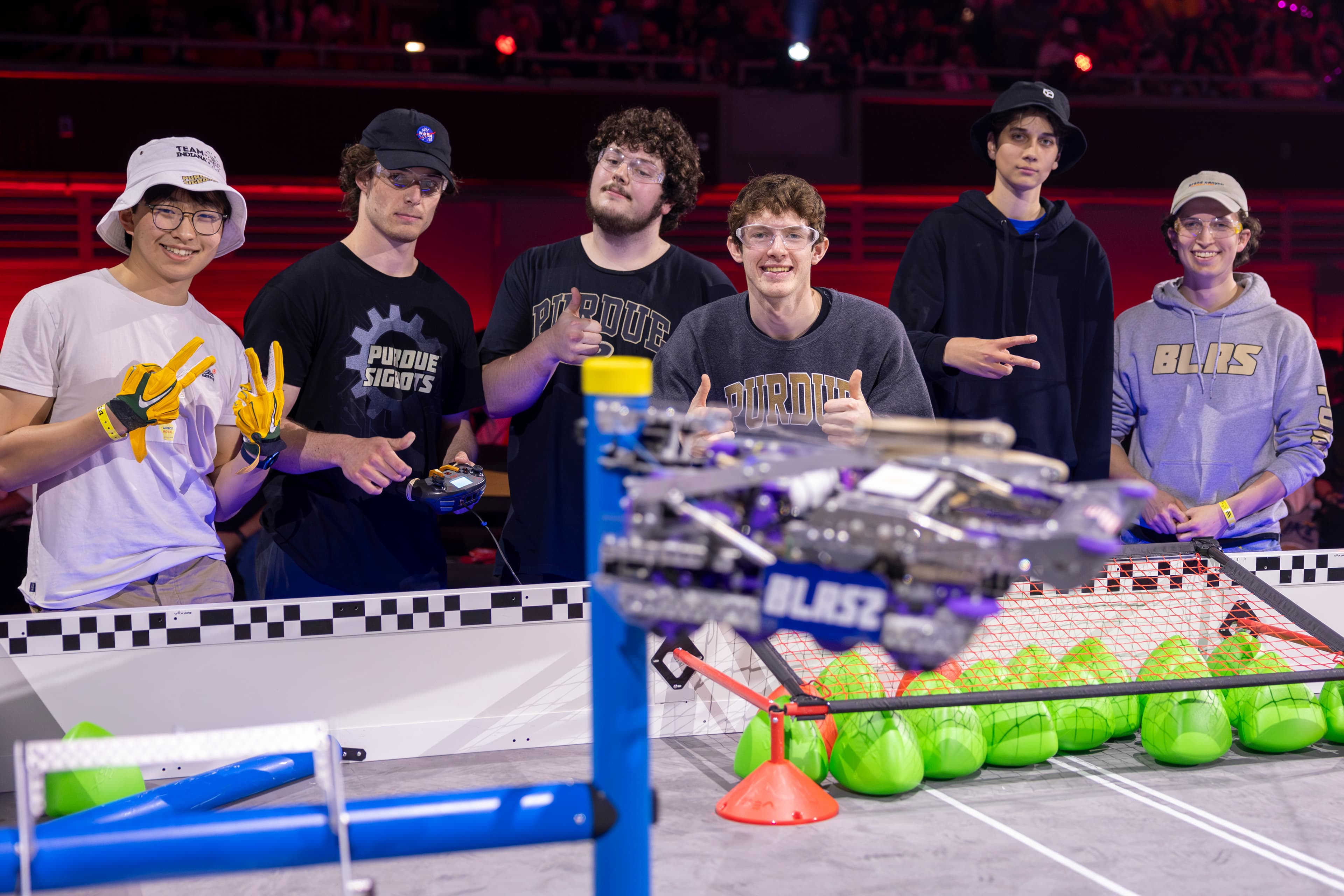 Purdue SIGBots members with a robot at competition